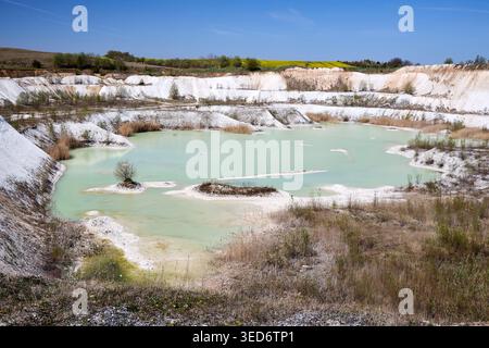 Old open cast mine. Industrial extraction of chalk and by mining. Lake in quarry. Abandoned quarry. Flooded chalk quarry Starovina deposit near Hrodna Stock Photo