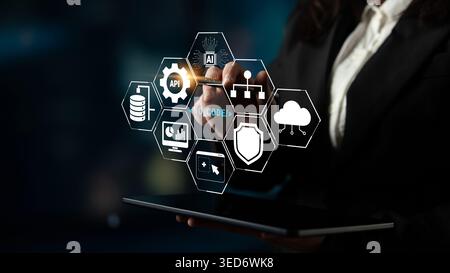 Business Professional Interacting with Digital Interface Featuring Technology Icons for API, Data, Coding, and Cloud Solutions Quark. Stock Photo