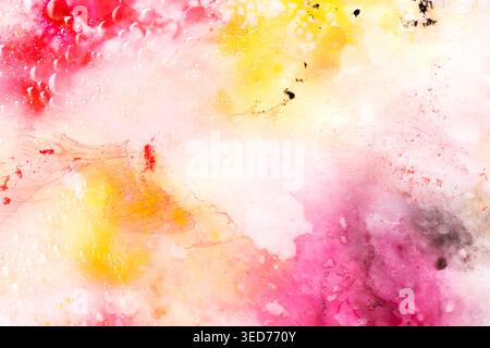 Abstract art with pink, red and yellow watercolour splashes and dots for creative background or wallpaper macro Stock Photo