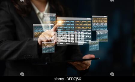 A business professional engages with a digital data display on a tablet, representing innovation in technology and data management in a modern office Stock Photo