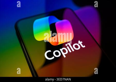 Paris, France - May 4, 2026: The Microsoft Copilot AI logo glowing on a smartphone screen, representing generative artificial intelligence. Stock Photo
