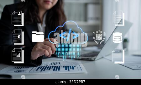 Businesswoman Engaging with Technology and Data Management Concepts in Modern Office Environment with Laptop and Digital Graphics Fluxor. Stock Photo