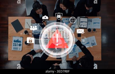 Red warning triangle representing a cybersecurity threat or data breach alert, surrounded by digital security and network protection icons Stock Photo