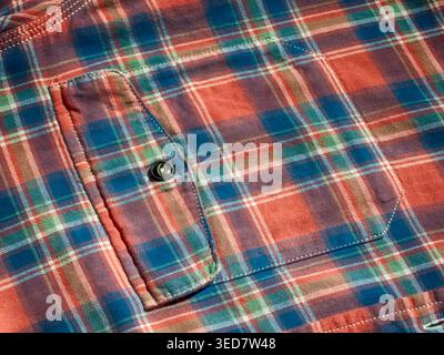 Blue-red check pocket, button, textile background Stock Photo