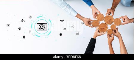 Collaborative Teamwork Concept with Hands on Wooden Gears and Digital Icons Representing Innovation and Problem Solving Quark. Stock Photo