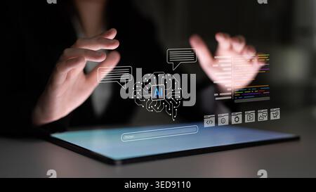 Hands hover over a tablet displaying innovative AI technology. The dark environment enhances the focus on graphic elements and speech bubbles Stock Photo