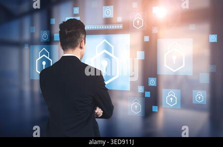 Business Professional Analyzing Digital Security Concepts on Screens in Modern Office Setting with Lock Icons and Data Visualization Elements Haptic. Stock Photo