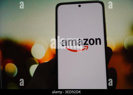 The Amazon logo displayed on a smartphone screen Stock Photo