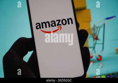 The Amazon logo displayed on a smartphone screen Stock Photo