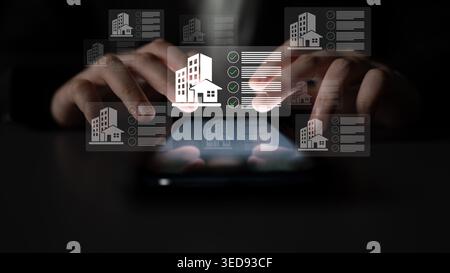 A person interacts with a smartphone displaying real estate information and checklists, illustrating modern digital management in a professional Stock Photo