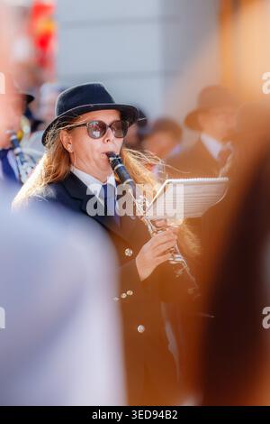 Oslo, Norway - May 17, 2025: Female clarinet player in formal uniform performs during Norwegian Constitution Day parade, adding music and festive spir Stock Photo