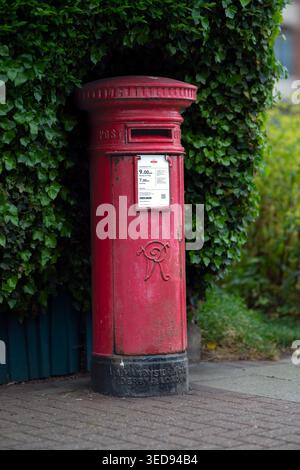 An early cast-iron Pillar Box made by Andrew Handyside & Co, Derby situated on the Esplanade , Sheringham, North Norfolk, UK Stock Photo