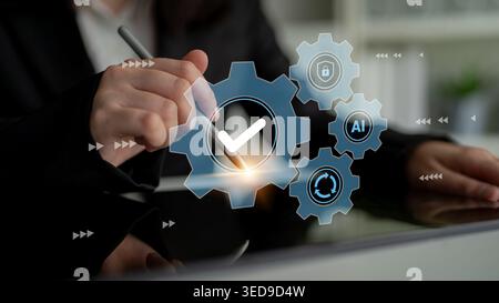 Business professional engages with virtual gears and checkmarks, symbolizing innovation and efficiency in the modern technology-driven workspace Stock Photo
