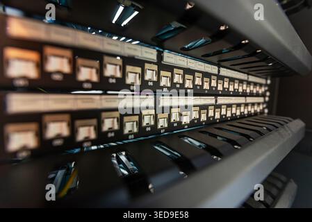 A close-up view of a network rack featuring organized patch panels and visible cabling, showcasing modern technology and connectivity in a data center Stock Photo
