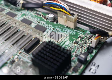 Detailed view of an electronic circuit board showcasing intricate components, connections, and design. Ideal for technology, engineering, and electron Stock Photo