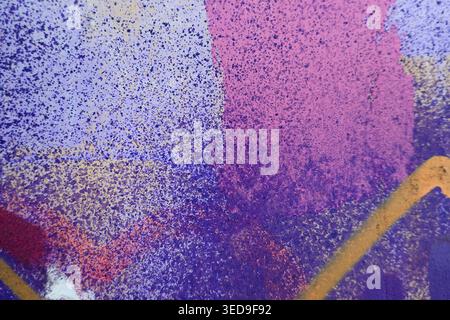 Beautiful brick wall colorful street art graffiti background. Abstract creative spray drawing fashion colors painting on the walls of the city. Urban Stock Photo
