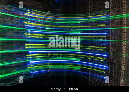 An artistic representation of vibrant light trails illuminating a data network, showcasing dynamic motion and technological innovation through abstrac Stock Photo