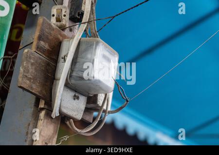 The image shows a utility pole with electrical wiring and equipment attached, representing urban infrastructure and electrical supply components on ci Stock Photo