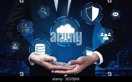 Business Professional Holding Cloud Technology Symbols with Data Protection and Digital Communication Concepts in a Modern Office Environment Haptic. Stock Photo