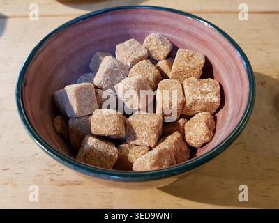 Cubes of brown sugar in a bowl, Luss, Scotland Stock Photo