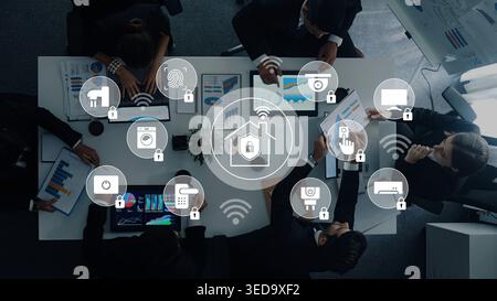 A group of business professionals examines smart home technology, emphasizing security and connectivity in modern living and the importance of Stock Photo