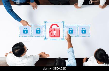 Business team collaborates on cybersecurity strategies, focusing on digital safety with visual representations of locks, sharing ideas and solutions Stock Photo