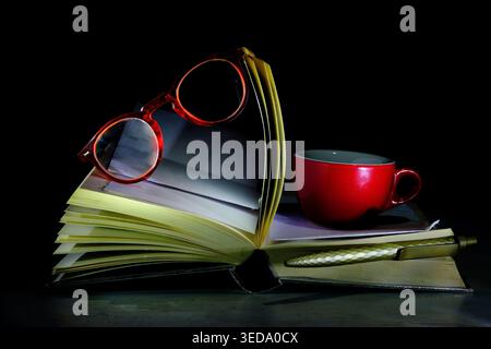 Book arrangement.Back to school,education,reading, learning, knowledge is power concept with book, eyeglasses,pen and a coffee cup Stock Photo
