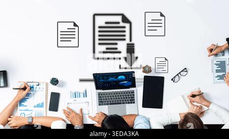 A group of professionals collaborates on data analysis in a modern office. Laptops, charts, and document icons emphasize teamwork and productivity in Stock Photo