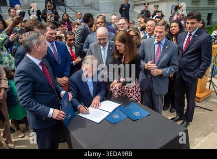 Connecticut Gov. Ned Lamont signs Senate Bill 397 at a ceremony on the ...