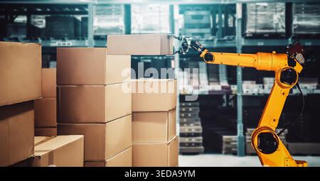 Smart robot arm system for innovative warehouse and factory digital technology . Automation manufacturing robot controlled by industry engineering Stock Photo