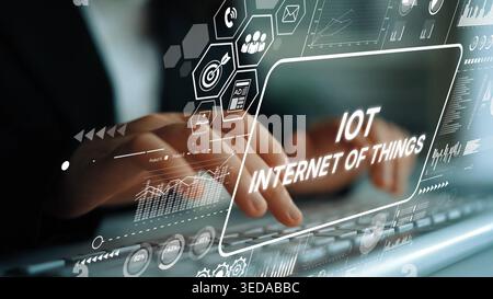 Innovative Concept of Internet of Things with Hands Typing on Keyboard Surrounded by Digital Graphics and Data Visualizations. Asymptotic smart data Stock Photo