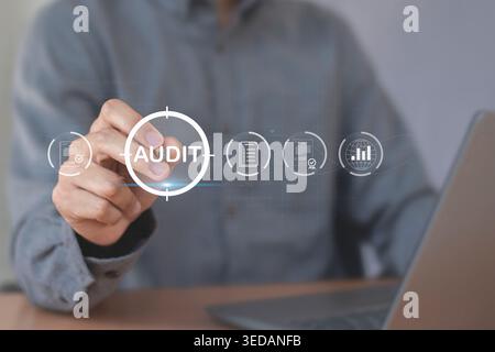 Person touching virtual audit button on digital interface Stock Photo