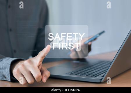 A sign displaying "Safety First" in an industrial workplace. Stock Photo
