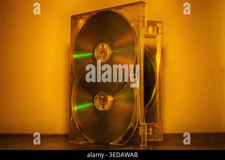 DVD disks in box against the wall - archives, culture, technology Stock Photo