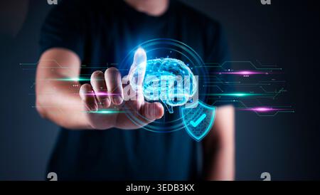 Man hand touching virtual brain and shield icon. Concept of Artificial Intelligence AI data security, machine learning protection, cyber safety techno Stock Photo