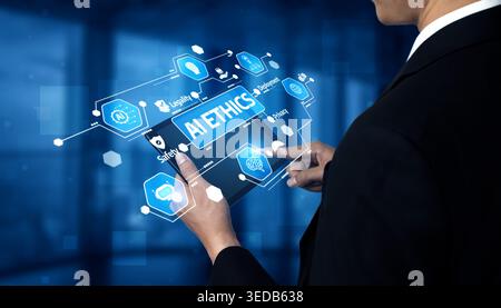 A business professional is engaging with a futuristic digital interface on a tablet, showcasing data analysis and strategic development in a modern Stock Photo