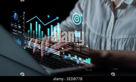 Woman Using Laptop with Data Visualization Graphic, Analyzing Charts and Graphs for Business Strategy and Performance Improvement Insights Haptic. Stock Photo