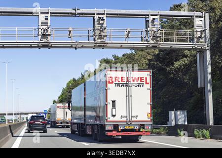 Antwerp, Belgium, May 01 2026. Overhead highway gantry equipped with ANPR tracking and speed cameras monitoring traffic and logistics trucks. Stock Photo