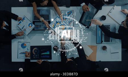 A diverse business team engages in a strategy meeting, utilizing artificial intelligence concepts to enhance data analysis and collaboration for Stock Photo
