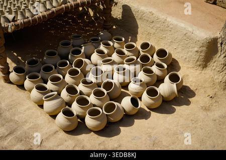 Close up of mud pots getting dried in sunlight after making. Stock Photo