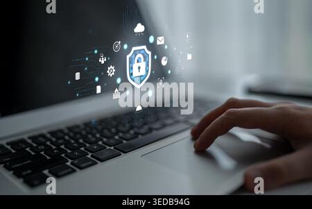 Digital Security Concept on Laptop Displaying Lock Symbol Surrounded by Technology Icons Representing Cyber Protection and Data Security Solutions Stock Photo