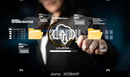 A professional woman interacts with a digital interface showcasing cloud upload and data management concepts. The background emphasizes modern Stock Photo