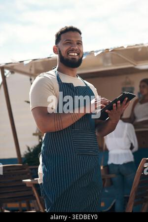 Food truck, portrait and man with tablet for management or planning of small business agenda. Tech, scroll and smile of mobile vendor outdoor for Stock Photo
