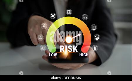 Business Professional Assessing Risk Levels with Smartphone Displaying Risk Meter Showing Low to High Range for Financial Decision-Making Fluxor. Stock Photo