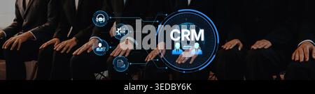 Business professionals demonstrate the importance of customer relationship management through technology and teamwork, focusing on enhancing client Stock Photo