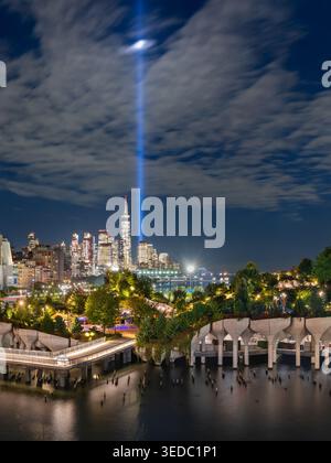 Little Island at night with the Tribute in Light September 11 memorial spotlight beams and Lower Manhattan skyline in New York City, USA Stock Photo