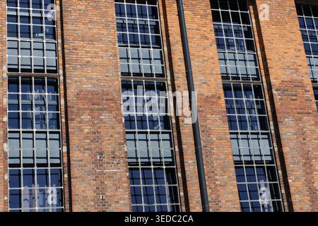 Red Brick Industrial Building Facade With Windows Stock Photo