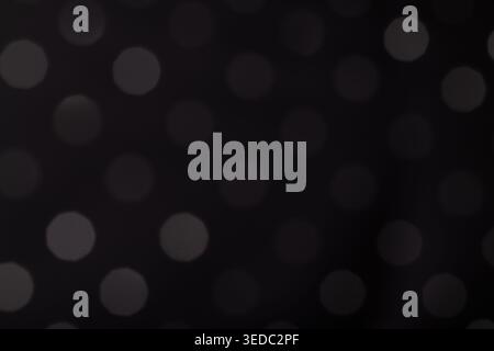 Abstract Grey Bokeh Dots on Black Background Stock Photo