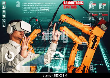 Engineer controls robotic arms by augmented reality industry technology application software. Smart robot machine in future factory working in concept Stock Photo