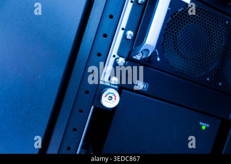 Close-up image of a pressure gauge mounted on a server rack. This image highlights essential monitoring equipment in a technical environment, emphasiz Stock Photo